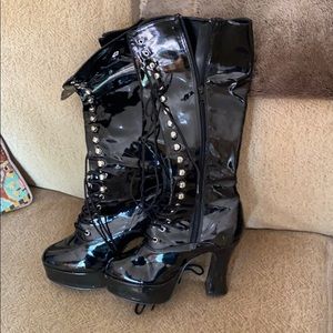 Lace up black vinyl boots